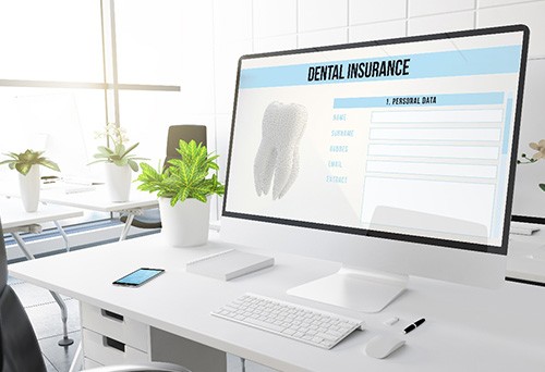 Dental insurance website open on computer