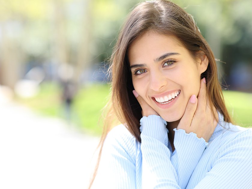 a patient smiling after receiving a smile makeover